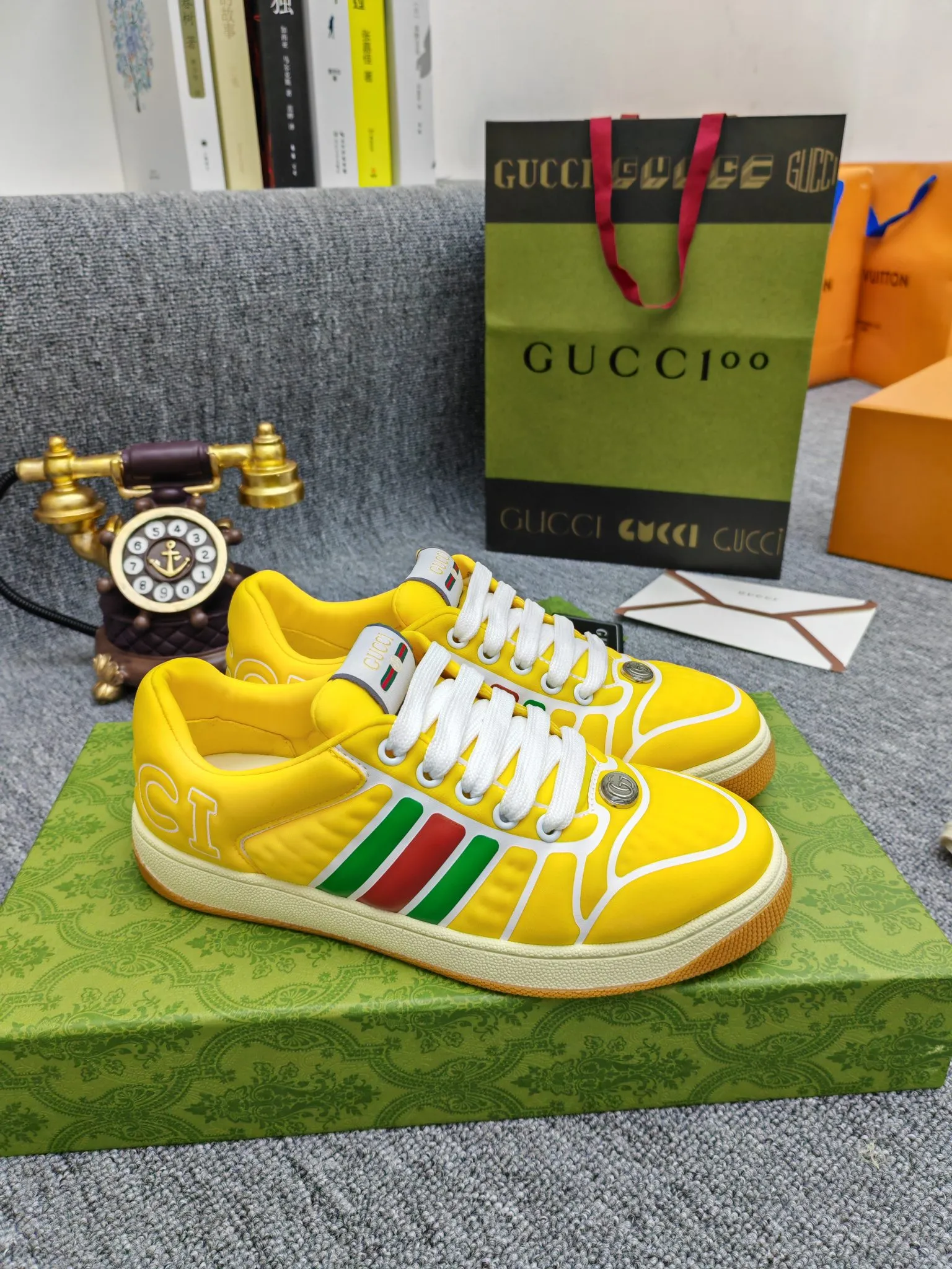 Factory price 600💰Screener series embellished web sneakers. This item is from the Gucci Lido series. Its design is inspired by the summer style and beach clubs of the Italian coast. The Screener series of sneakers draws inspiration from classic sneakers from the 1970s and takes its name from a special defensive move in sports. This shoe from the 2024 Pre-Fall collection is crafted from yellow rubber, a technical and malleable opaque material, with striped webbing on the sides and an embossed Gucci printed logo on the heel. Yellow rubber, opaque and technological in appearance. Red and green webbing decorated with metal Double G oval enamel details. Gucci printed embossed logo. Women 35-40, men 38-45, (men 38 and 45 need to be customized)